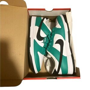 Green , white , black Nike dunks